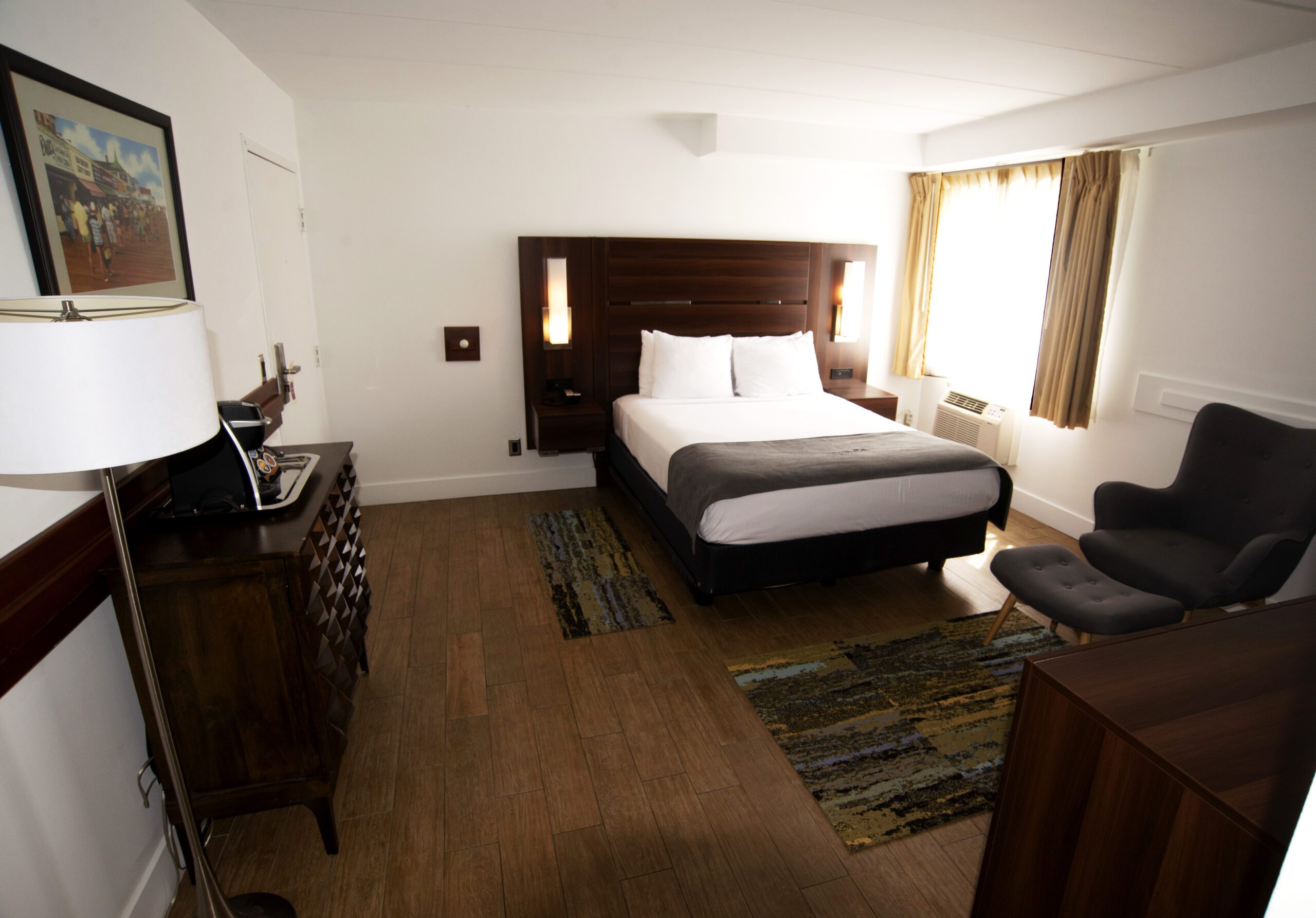 A Single Bed With A Wooden Headboard